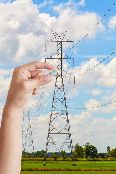 Hand against the background of high-voltage wires — Stock Photo, Image