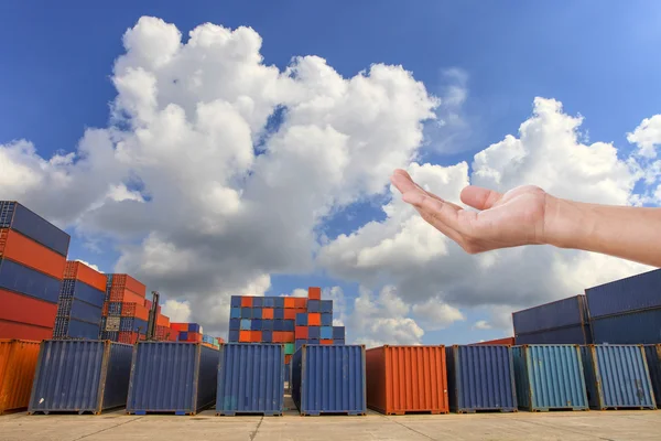 Hand against the containers in the dock — Stock Photo, Image