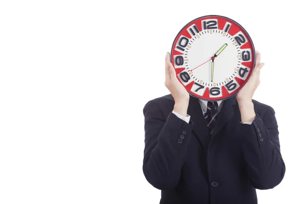 Businessman holding a clock Stock Picture