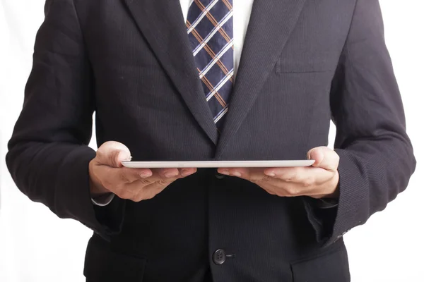 Affärsman som håller i en tablett — Stockfoto