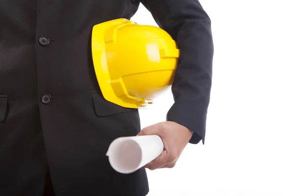 Ingeniero de construcción con casco amarillo y documentos en mano —  Fotos de Stock