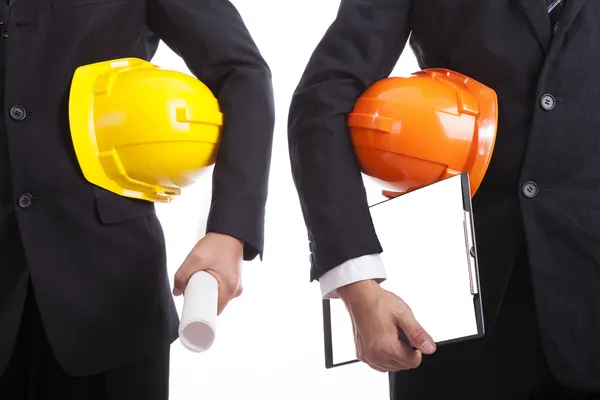 Construction engineers with helmets and documents — Stock Photo, Image