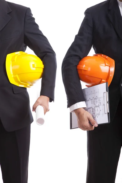 Construction engineers with helmets and documents — Stock Photo, Image