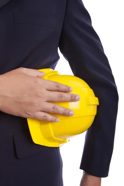 Construction engineer holding a yellow hard hat — Stock Photo, Image