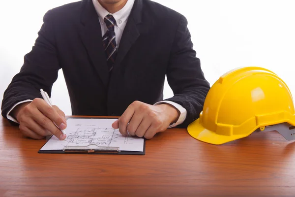 Engineer signs documents — Stock Photo, Image