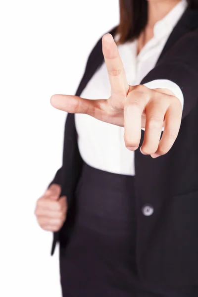 Businesswoman in black suit points with her index finger — Stock Photo, Image