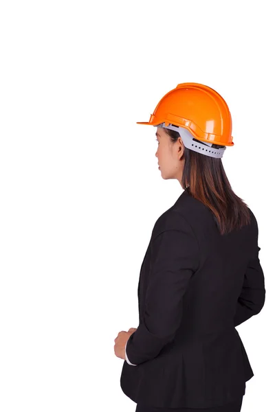 Female engineer standing with orange helmet on her head — Stock Photo, Image