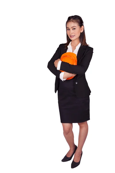 工程师女人手里拿着一个橘黄色的头盔 — 图库照片