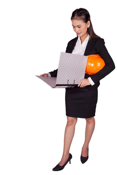 Female engineer holding an orange hard hat and a folder with documents — Stock Photo, Image