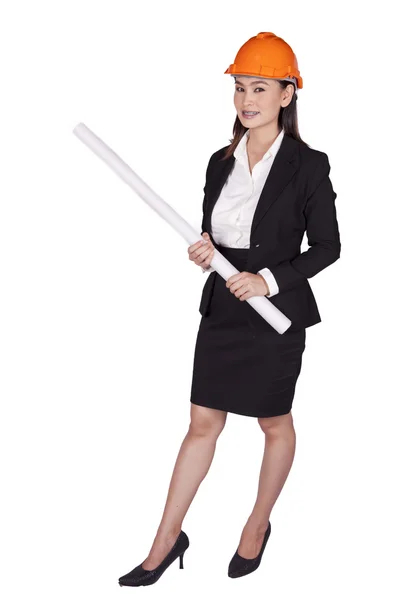 Engineer woman in an orange helmet holding a plan for the project — Stock Photo, Image