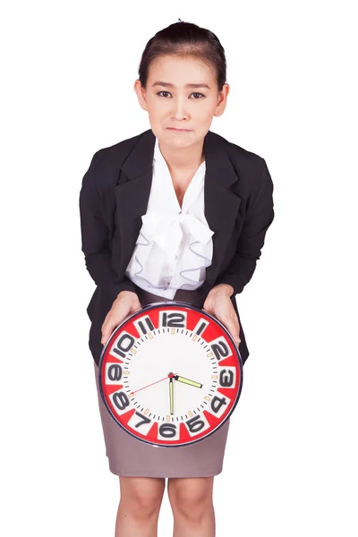 Sosteniendo un gran reloj rojo —  Fotos de Stock