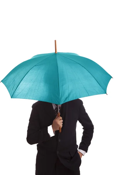 Businessman standing with a blue umbrella — Stock Photo, Image