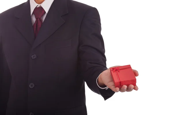 Businessman holding a gift box — Stock Photo, Image