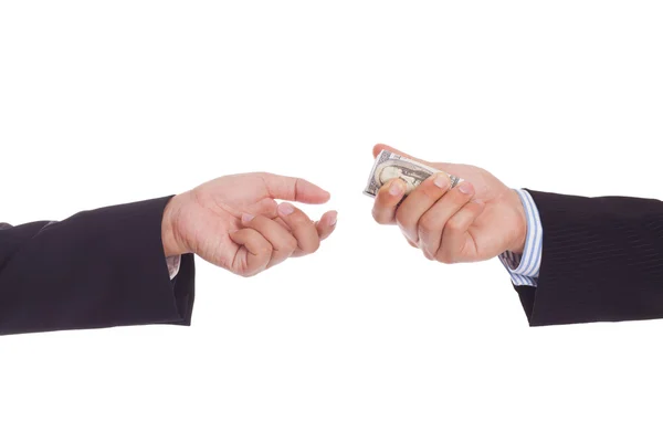 Businessman offering a bribe to another businessman — Stock Photo, Image