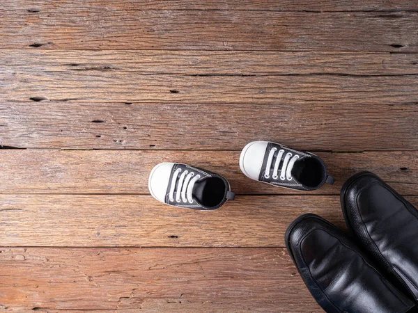 Lovely Baby Shoes Wooden Background His Father Boot Prepare Baby — Stock Photo, Image