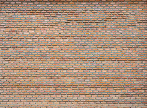 レンガ壁の抽象的なテクスチャパターンと風化した散乱の色 — ストック写真