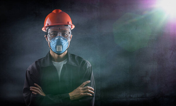 a worker man on standing action with protective equipment ready to operate procedure and work hard