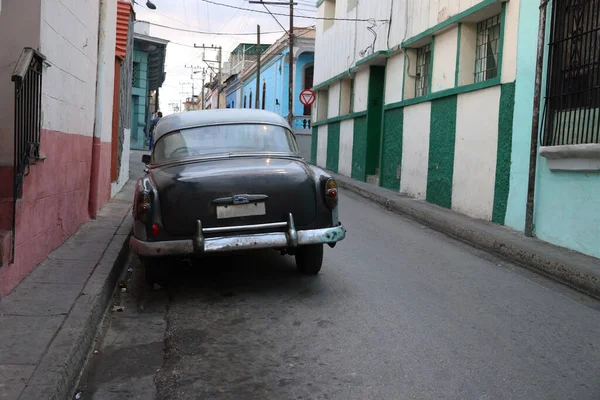 Vintage car in a street of Santiago de Cuba, Cuba. High quality photo