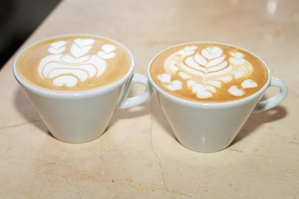 Cappuccino cups on table — Stock Photo, Image