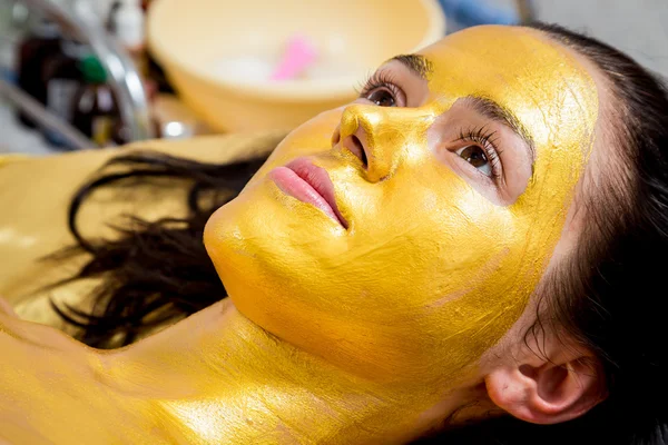 Gold facial mask — Stock Photo, Image