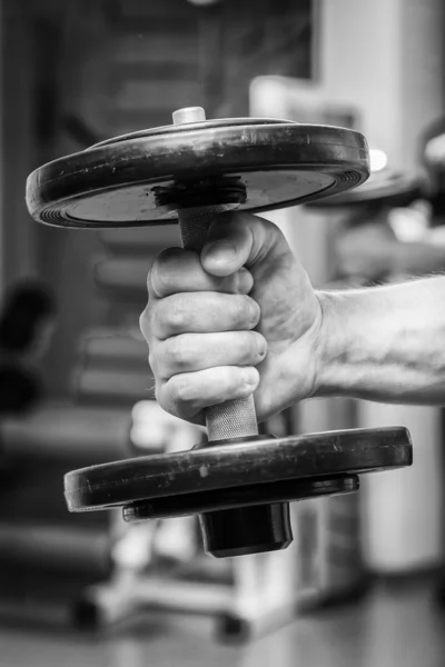 Man doing exercises with dumbbell — Stock Photo, Image