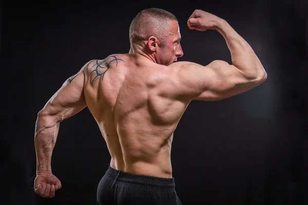 Muscle man with tattoos — Stock Photo, Image