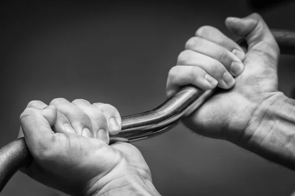 Hand holding barbell — Stock Photo, Image