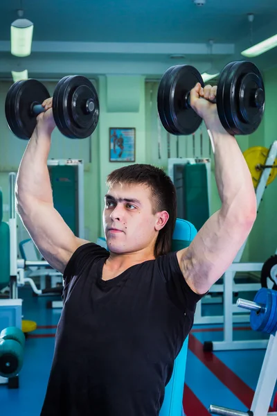 Man exercising with dumbbells — Stock Photo, Image