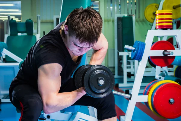 Man exercising with dumbbell — Stock Photo, Image