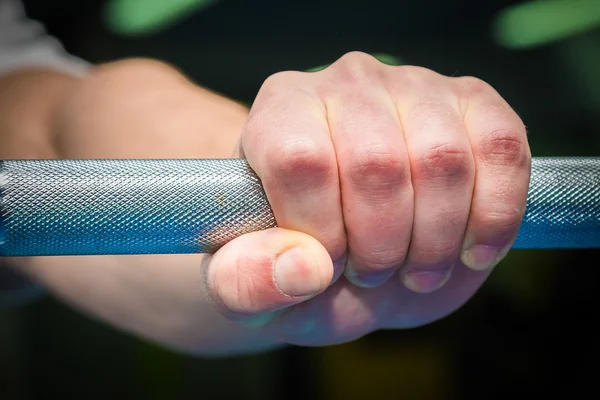 Hand  with a bar weights — Stock Photo, Image