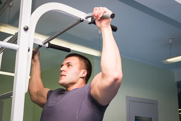 Man pulled on the bar — Stock Photo, Image