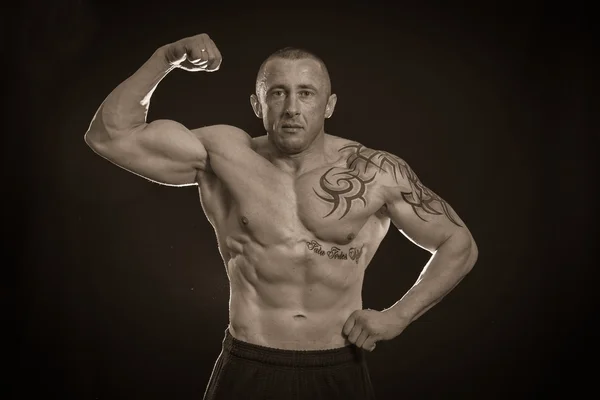 Muscle man with tattoos — Stock Photo, Image