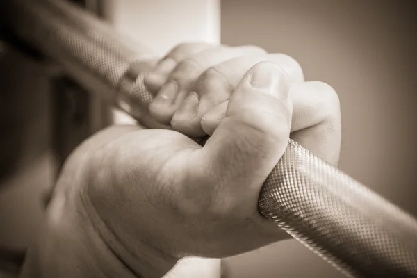 Hand on the training bar — Stock Photo, Image