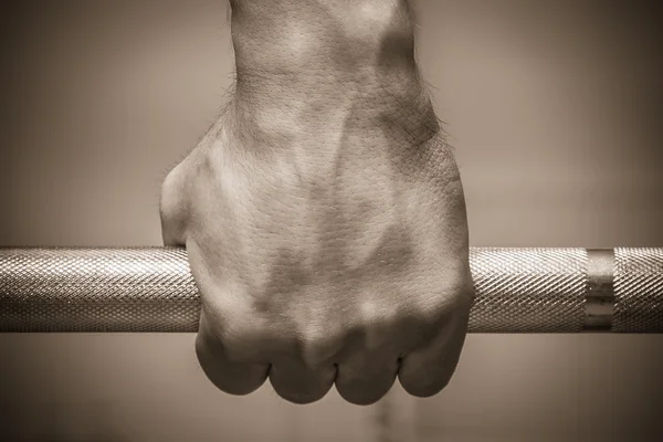 Hand on the training bar — Stock Photo, Image