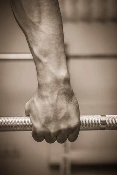 Hand on the training bar — Stock Photo, Image
