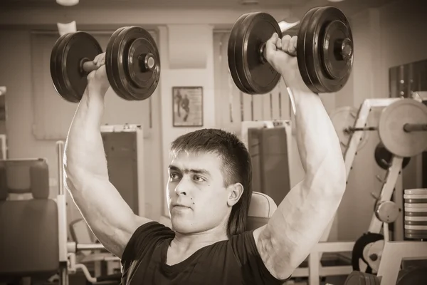 Man doing workout with dumbbell — Stock Photo, Image