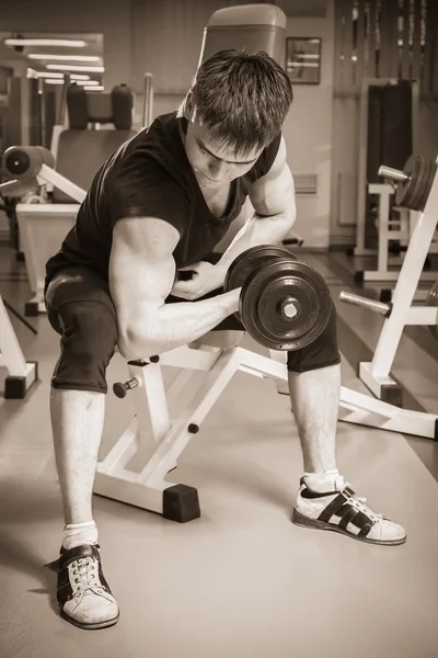 Man doing workout with dumbbell — Stock Photo, Image