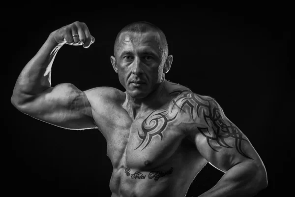 Muscle man with tattoos Stock Photo