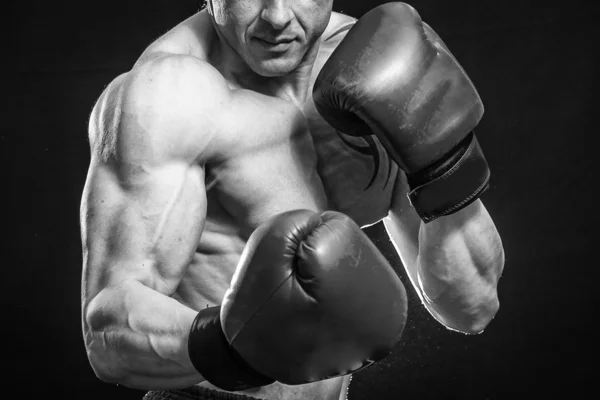 Man with tattoo  in boxing gloves — Stock Photo, Image