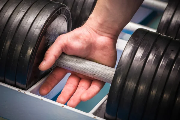 Hand holding dumbbell — Stock Photo, Image