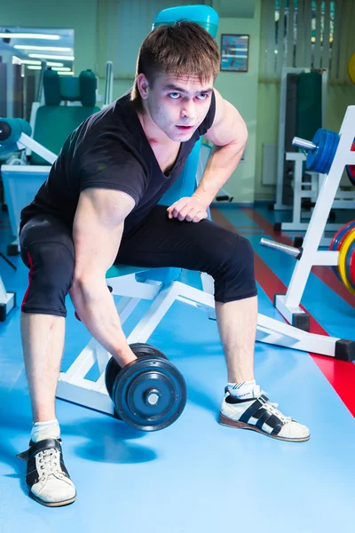 Man working with dumbbells — Stock Photo, Image