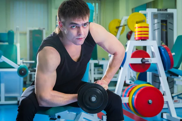 Man working with dumbbells — Stock Photo, Image