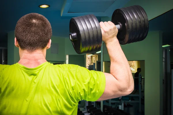 Man working with dumbbells — Stock Photo, Image