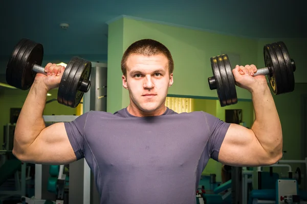 Man exercising with dumbbells Royalty Free Stock Images