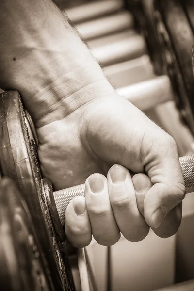 Mans hand with dumbbells. — Stock Photo, Image