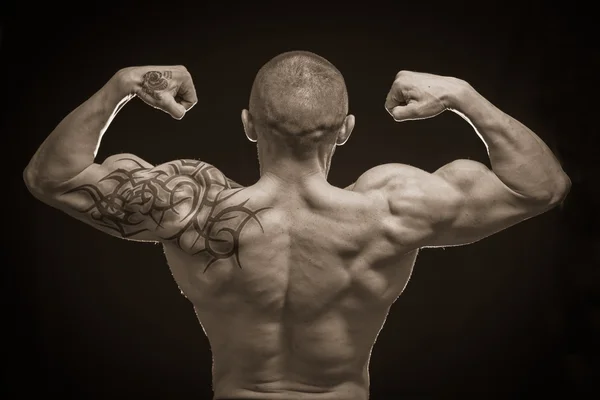 Muscle man with tattoos — Stock Photo, Image
