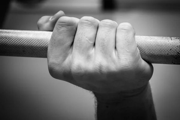 Hand holding barbell — Stock Photo, Image