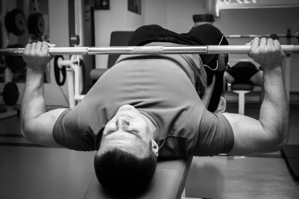 Man  with athletic barbell — Stock Photo, Image