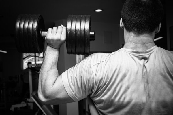 Man exercising with dumbbells