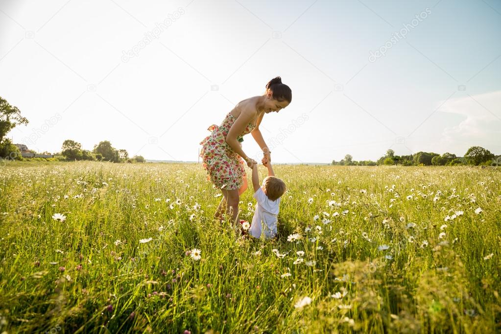 Mom and son playing in a field